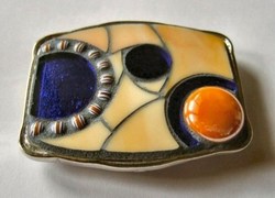 belt buckle with orange and blue glass, millefiori (fused)
and a glass nugget, 72 x 60 mm